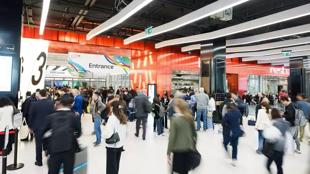 Visitors crowding the WIPESTAR booth at INDEX 2026 Geneva exhibition Booth 2150 with staff demonstrating cleanroom wipes and swabs
